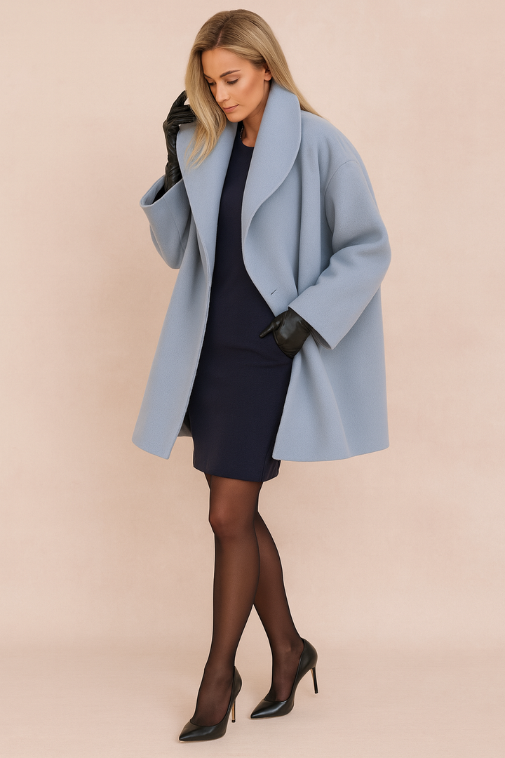 Elegant women's long-sleeve relaxed fit open-front jacket. Modern winter outerwear for comfortable city fashion.
