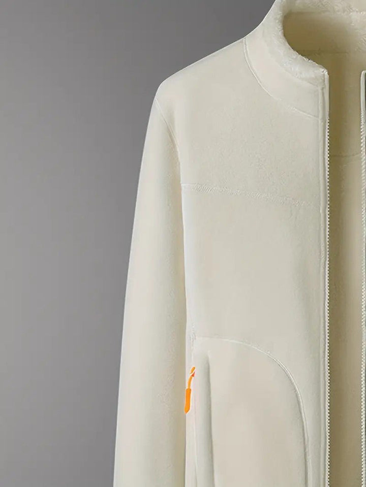 Versatile women's reversible jacket in pink and ivory, a cozy and stylish choice for winter fashion.