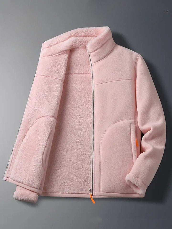 Cozy women's winter outerwear: reversible jacket with stand collar, perfect for cold weather fashion.
