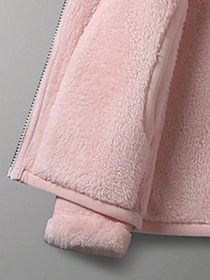 Essential women's reversible winter jacket, warm & fashionable, in popular pink and ivory hues.