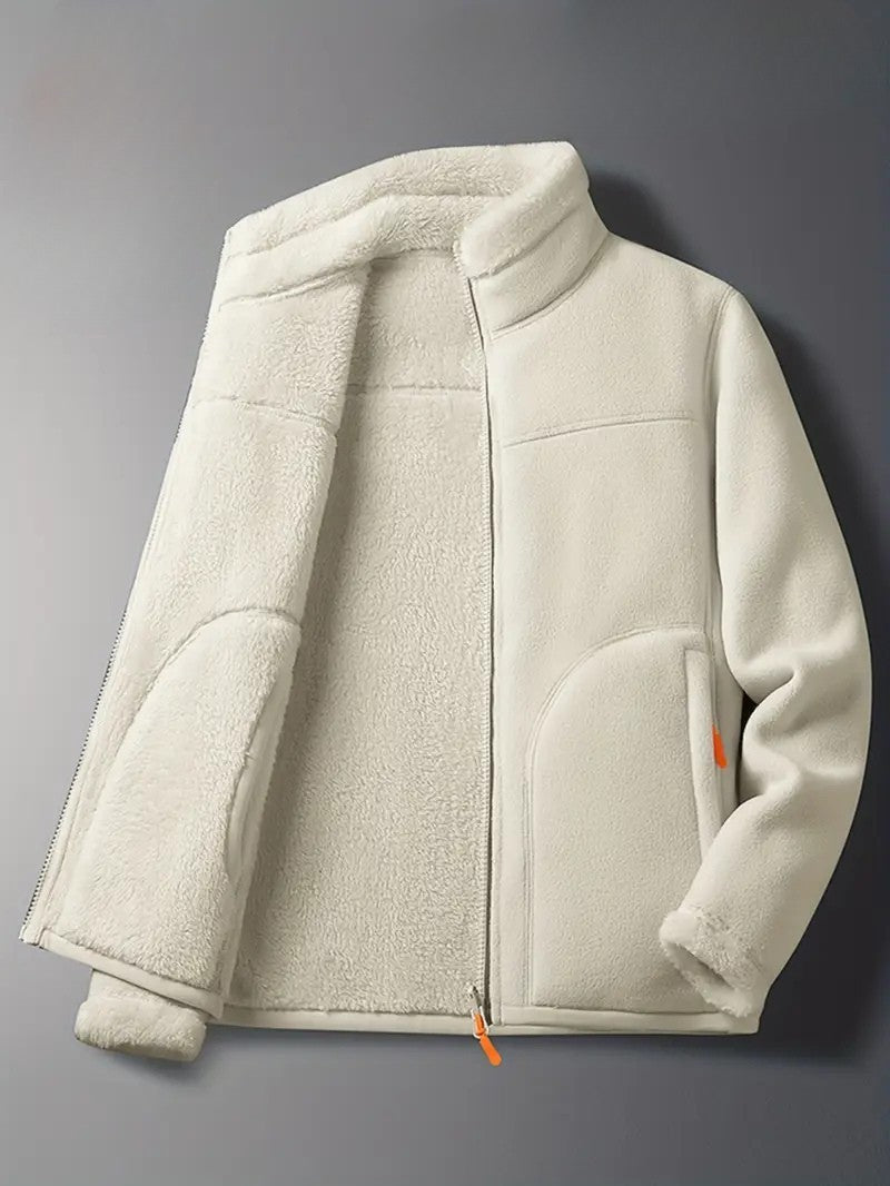 Full shot of a woman wearing the pink reversible winter jacket, styled for cool weather comfort.