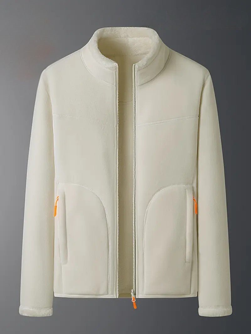Full shot of a woman wearing the ivory reversible winter jacket, a chic outerwear essential.