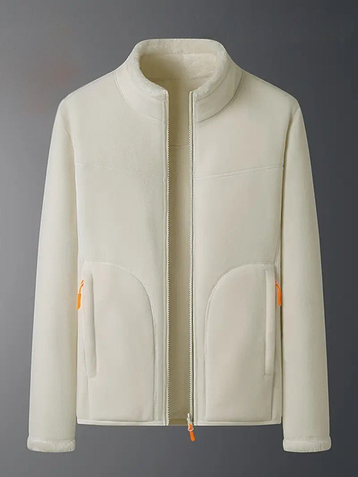 Full shot of a woman wearing the ivory reversible winter jacket, a chic outerwear essential.
