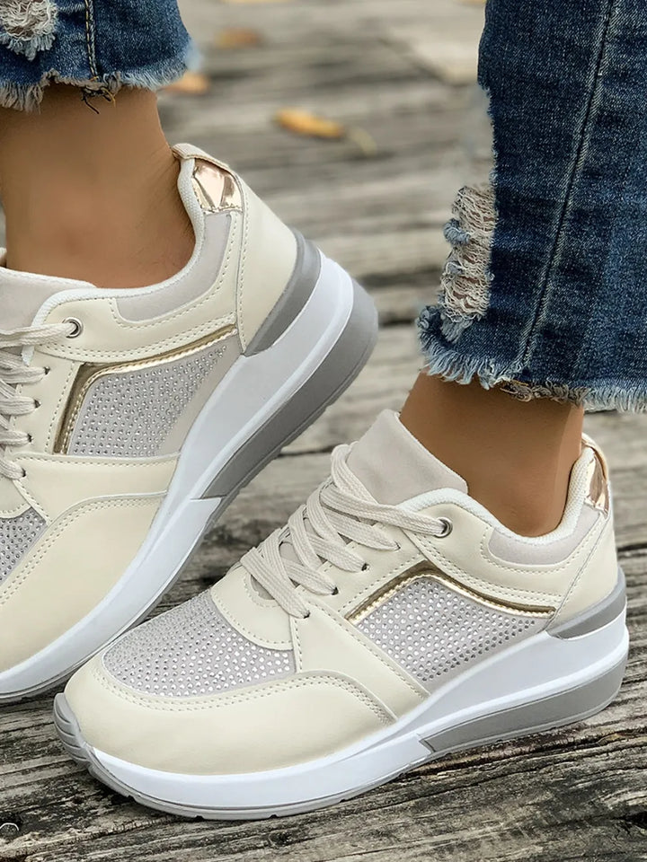 Side view of comfortable women's lace-up sneakers with a chic platform design.