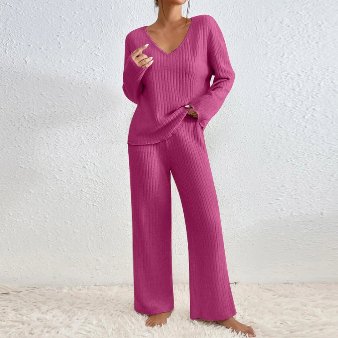 Woman wearing cozy ribbed knit lounge set. Perfect two-piece for comfortable travel, home relaxation, or casual outings.