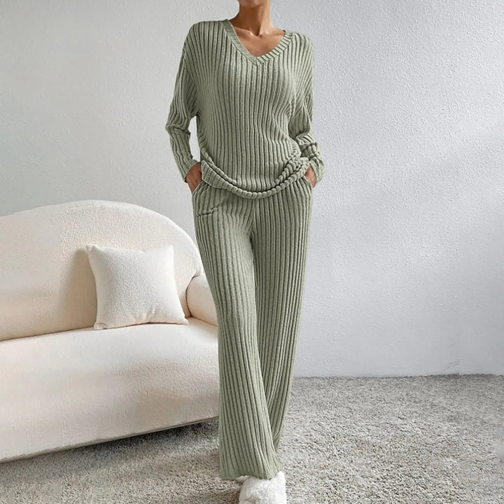 Women's ribbed knit lounge set, featuring relaxed fit top & bottoms. Chic two-piece for ultimate comfort.
