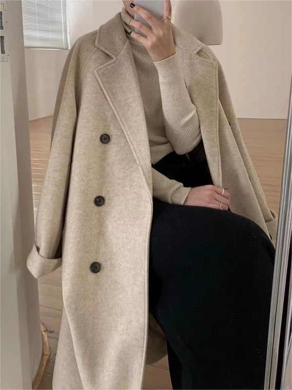 Chic women's winter coat with classic lapel and adjustable belt. Stylish and warm women's outerwear.