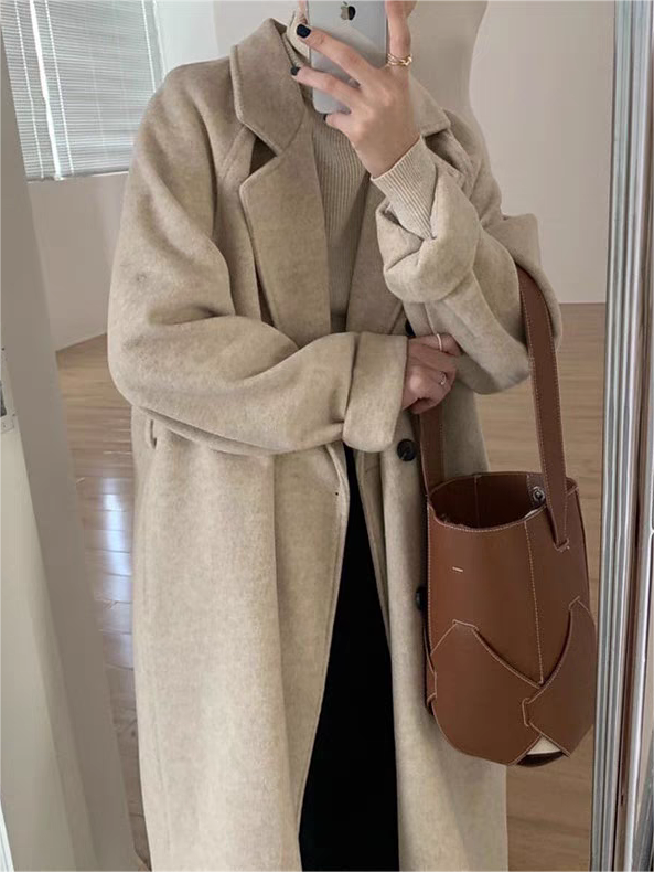 Elegant women's classic coat for winter, featuring a flattering belted waist and timeless design.