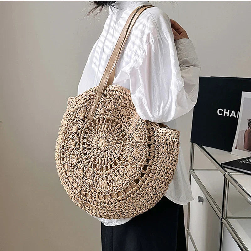 Women's round woven beach tote bag, perfect for summer vacations & natural style.