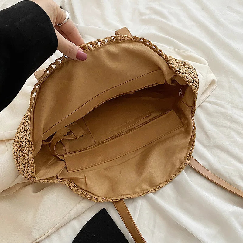 Chic women's round woven beach bag, a perfect summer shoulder tote with natural style.