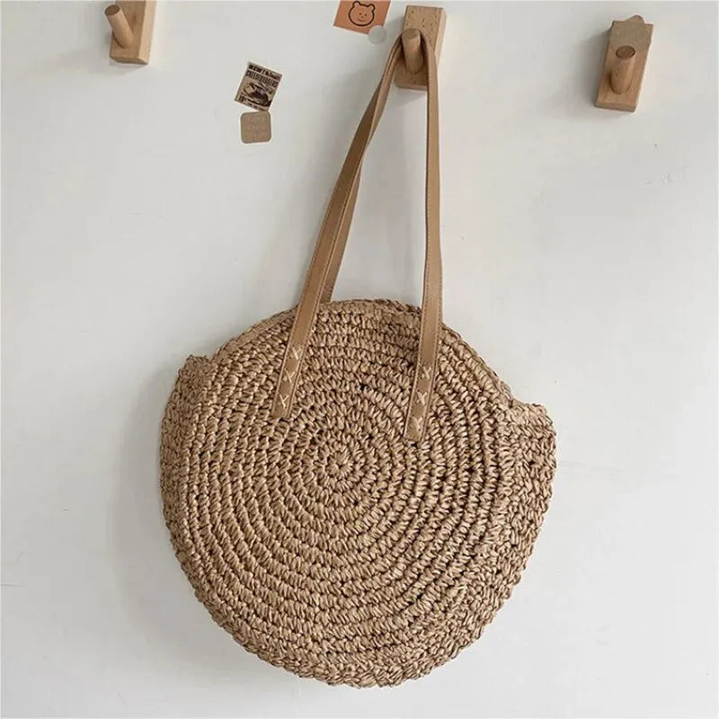 Women's round woven beach tote bag, summer shoulder bag, natural vacation handbag.