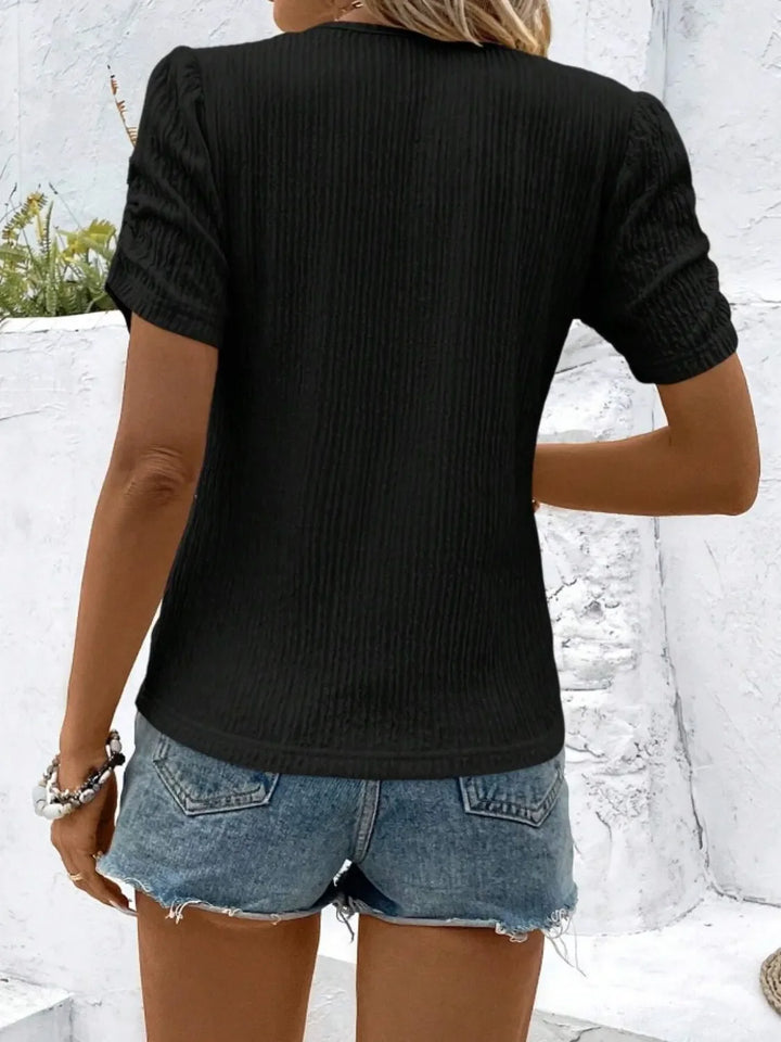 Trendy women's ruched top, ideal for transitioning seasons