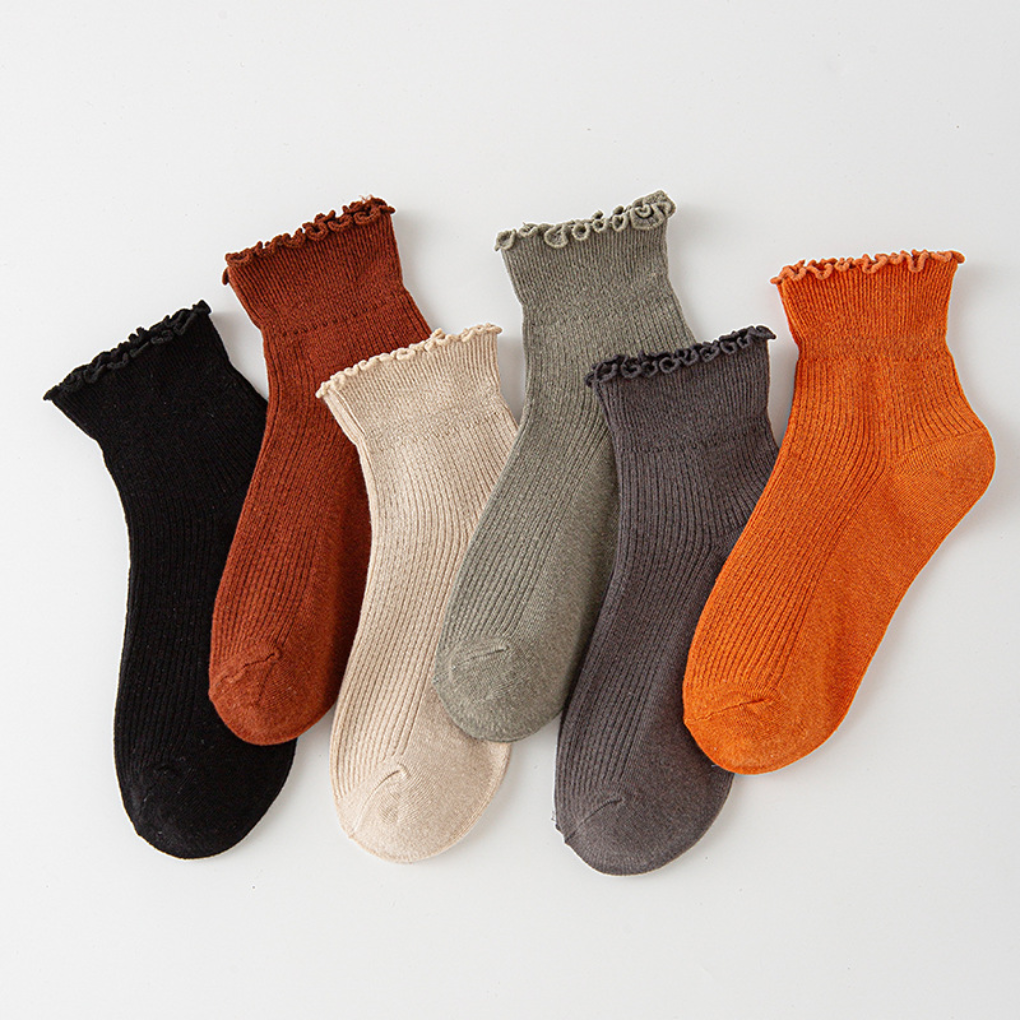 Decorative multi-pack women's ankle socks with delicate ruffled trim. Stylish frilly low-cut socks for fashion-forward ladies. [[lstfy-media:2]]
