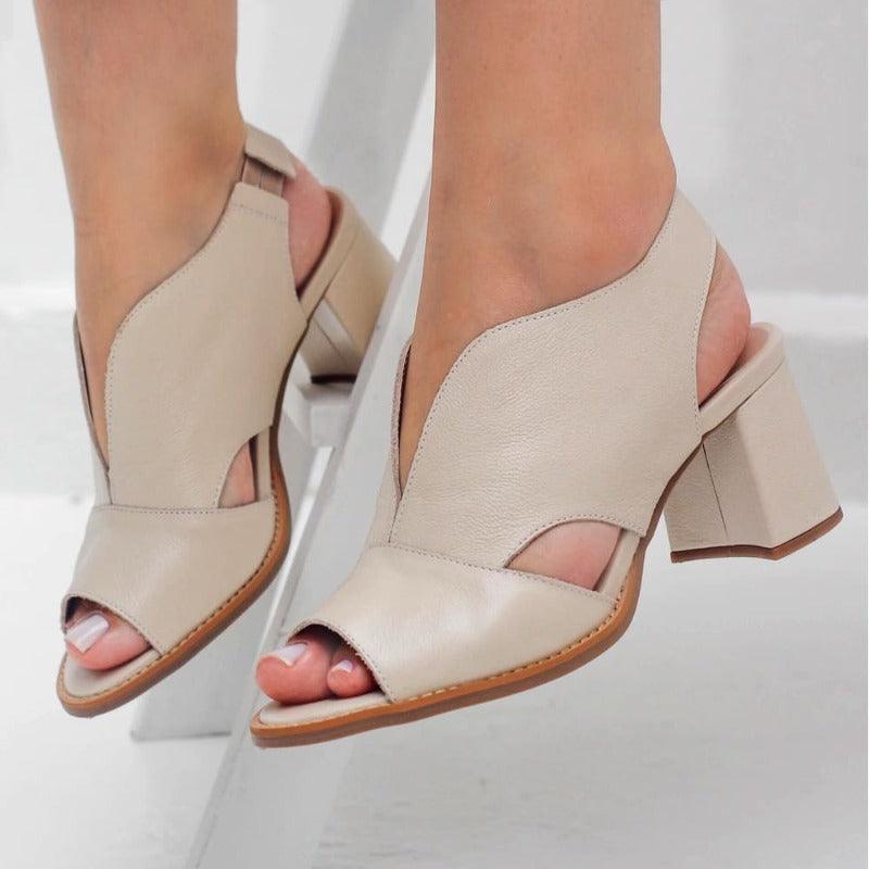 Women's Selina heeled sandals featuring an adjustable buckle and supportive comfort footbed.