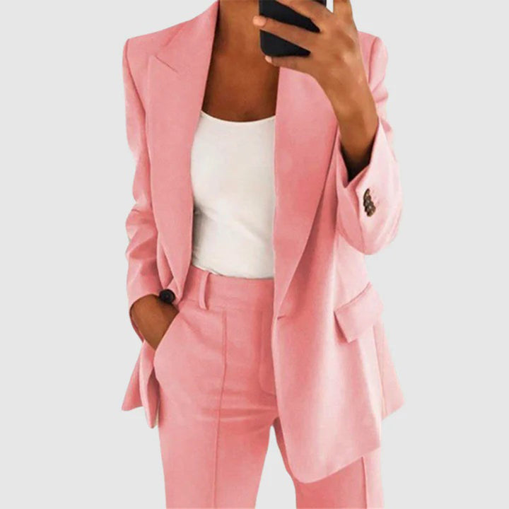 Stylish women's trouser suit. Elegant two-piece outfit, perfect for formal wear, business attire, & versatile fashion.