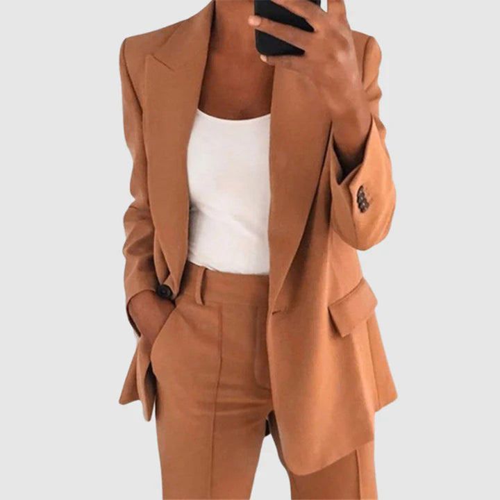 Chic women's tailored blazer and trousers set. This elegant outfit suits professional business attire & stylish occasions.