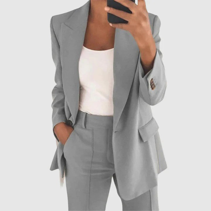 Modern women's business attire: an elegant blazer and trouser suit. This versatile two-piece set is perfect for office wear.