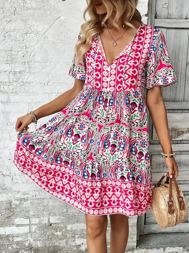 Women's tie neck short sleeve mini dress in a vibrant color