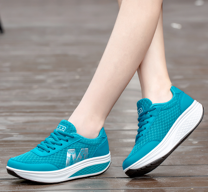 Woman wearing Skyler orthopedic walking sneakers, demonstrating proper posture and alignment.