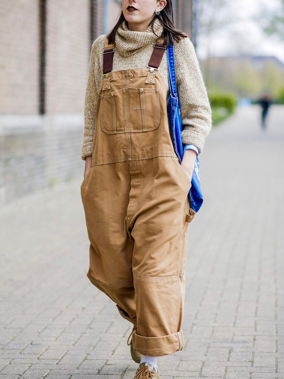 Fashionable women's jumpsuit with utility pockets and a relaxed fit.