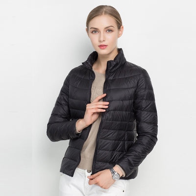 Casual women's slim fit quilted puffer jacket. Ideal layering piece with stand collar & zip closure.