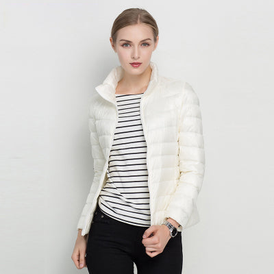 Women's slim fit quilted puffer jacket. Warm stand collar zip-up winter coat, perfect for casual fashion.