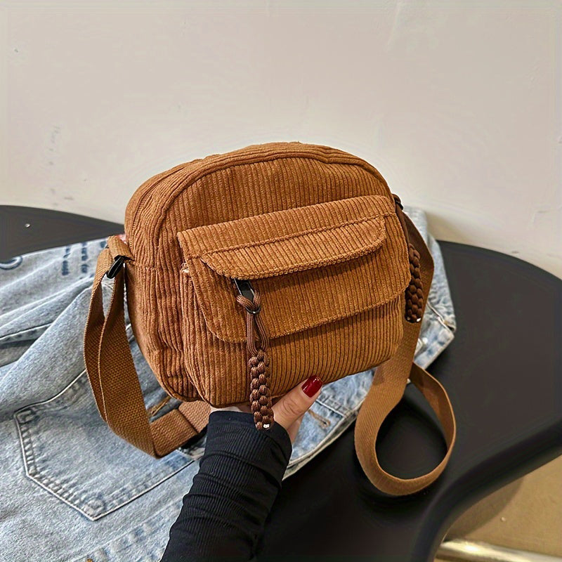 Women's small crossbody bag with textured finish, perfect for everyday wear.
