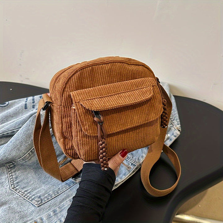 Women's small crossbody bag with textured finish, perfect for everyday wear.
