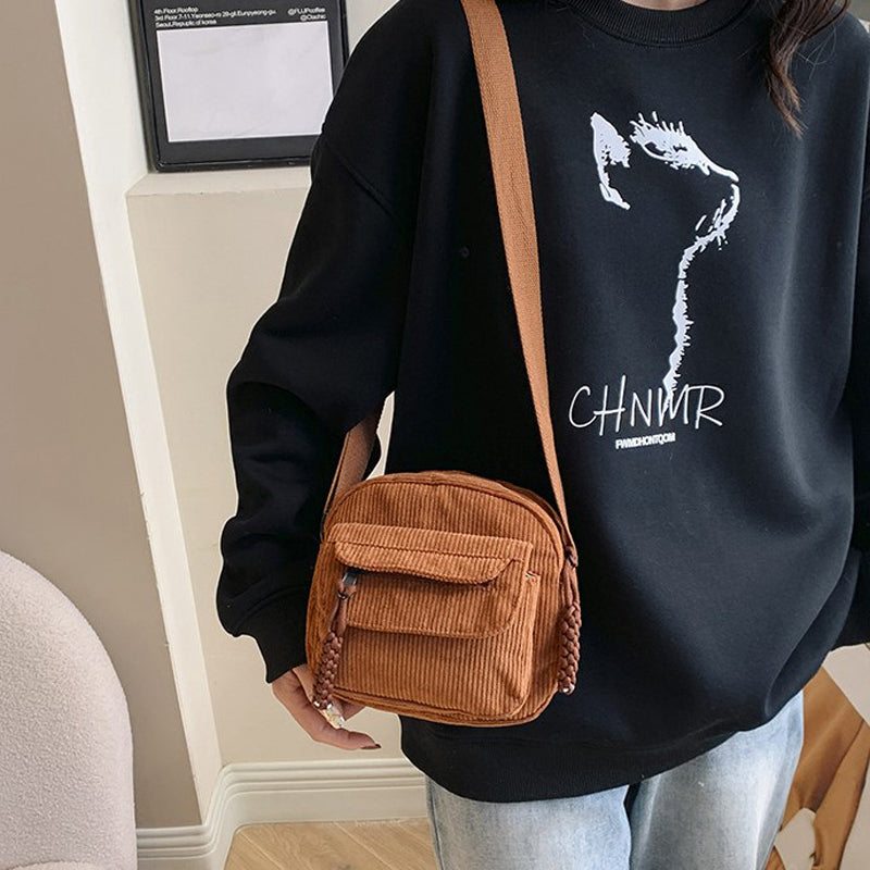 Compact vintage-style crossbody bag for women, great for essentials.