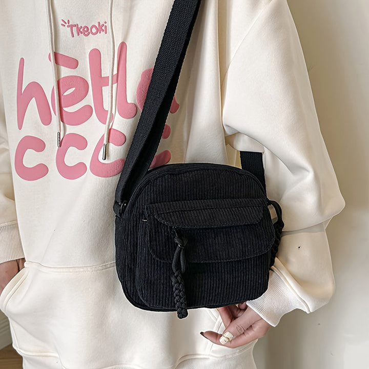 Essential women's crossbody bag with a secure zip compartment.