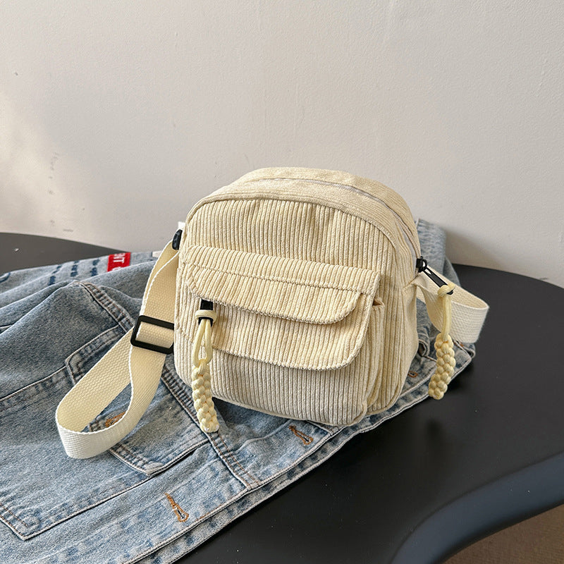 Elegant textured crossbody bag for women, a sophisticated accessory.