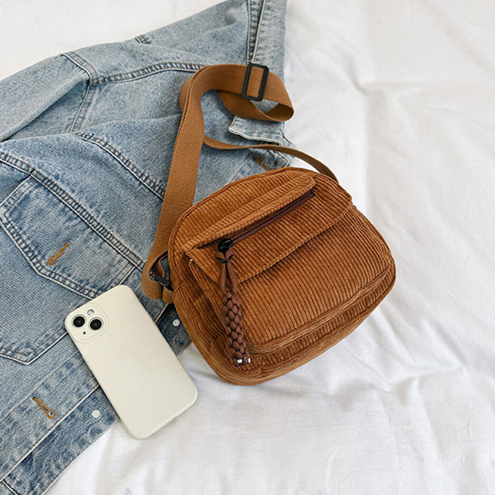 Fashionable textured crossbody bag for women, blending vintage and modern style.