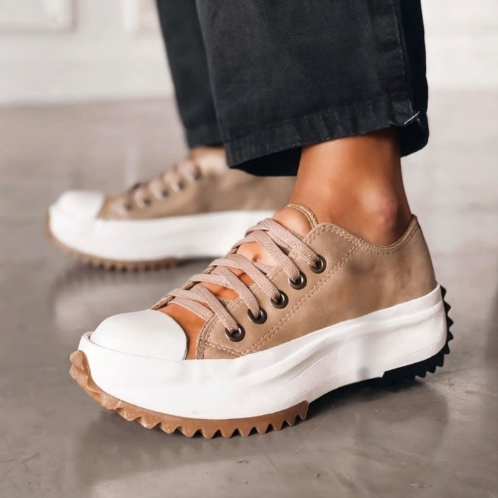 Trendy women's chunky platform sneakers in white, offering stylish comfort and fashion-forward look.