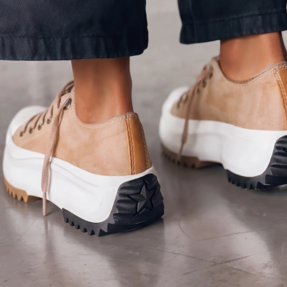 Side view of women's white orthopedic platform sneakers, highlighting chunky sole & comfortable design.