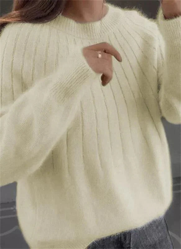 Chic fashion: Women's Sofie cashmere sweater, an essential autumn fashion wardrobe staple.
