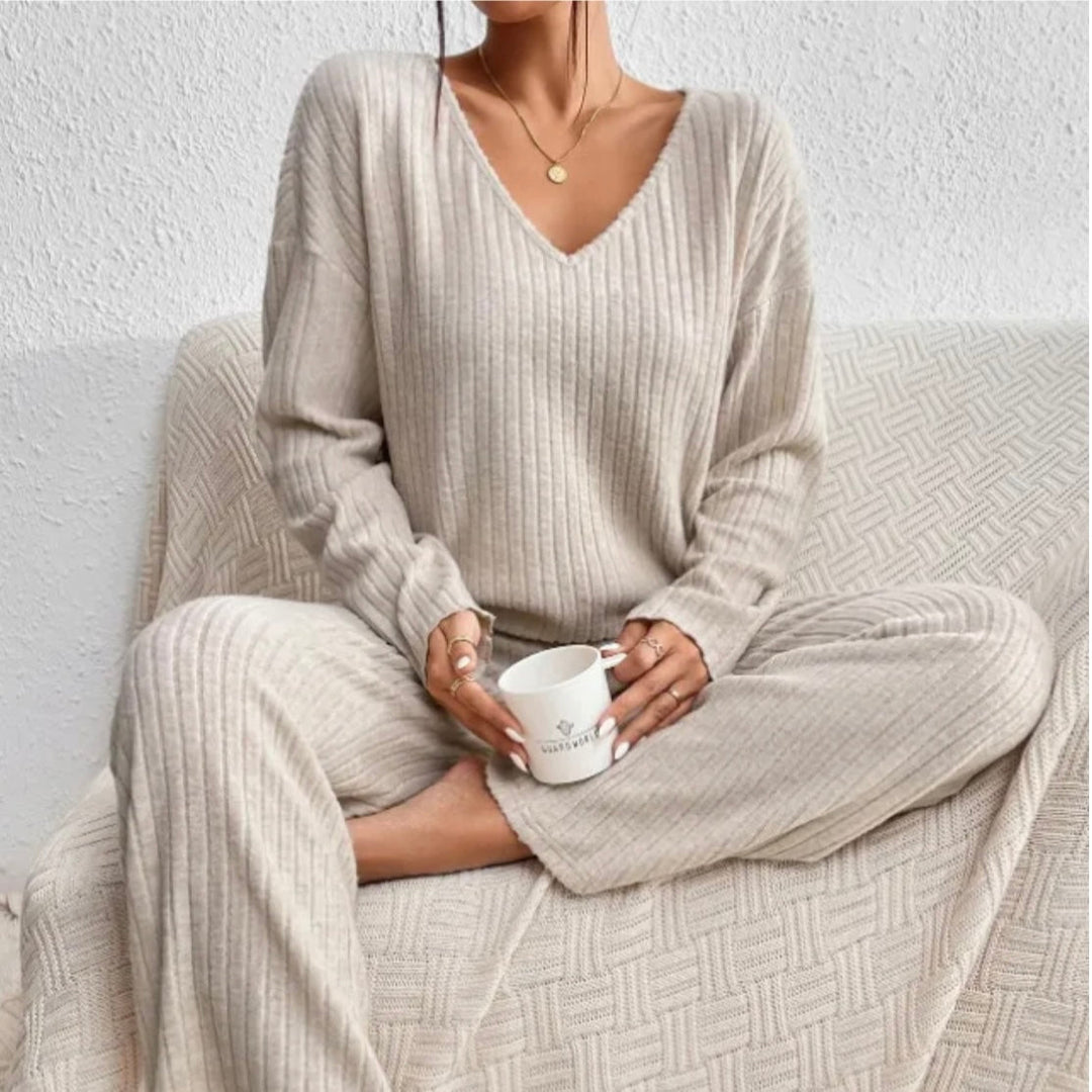 Modern women's knitted lounge set. Stylish and warm two-piece for autumn fashion.