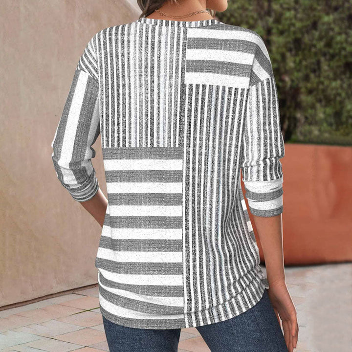Elegant women's striped blouse, a stylish and versatile top ideal for both casual wear.