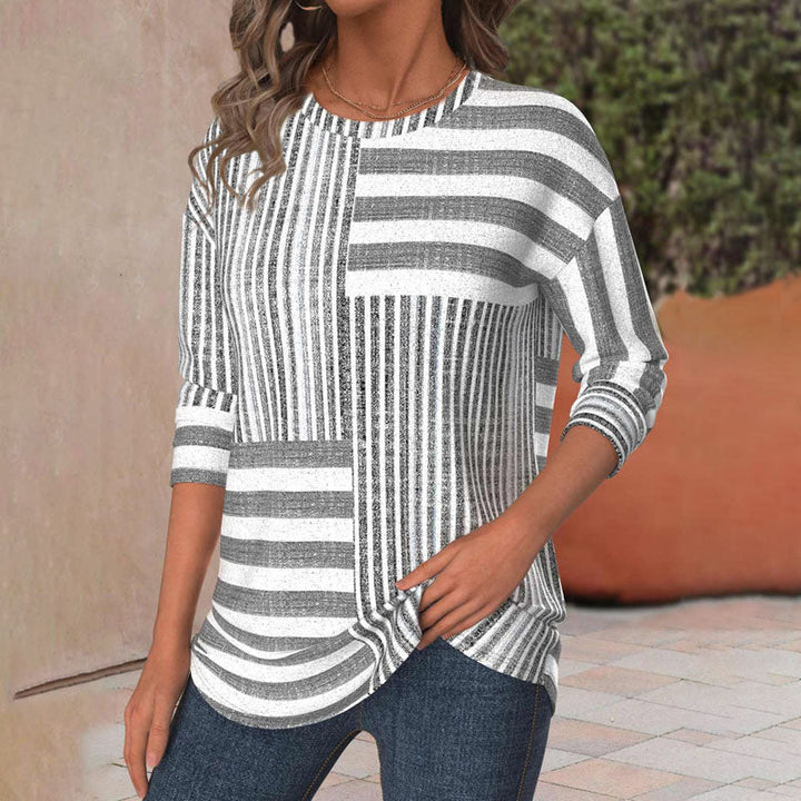 Relaxed fit women's striped top, a comfortable and stylish blouse for effortless casual wear.