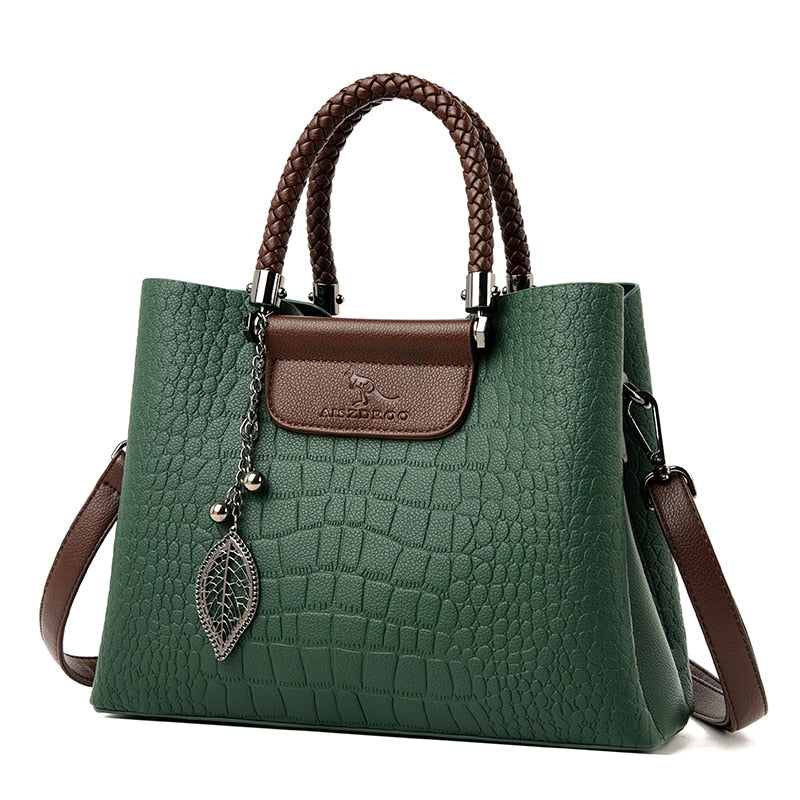 Model carrying the Sophia women's fashion accessory, a versatile green leather tote bag.