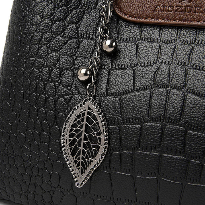 Detail shot of the Sophia women's black handbag, highlighting elegant hardware and stitching.