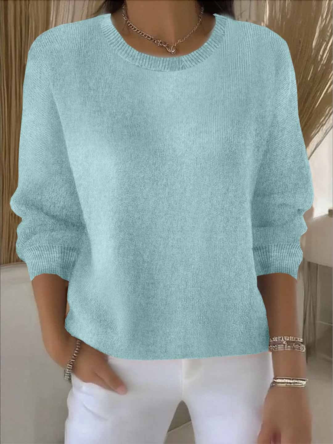 Fashionable women's V-neck sweater, a key piece for stylish fall and winter outfits.