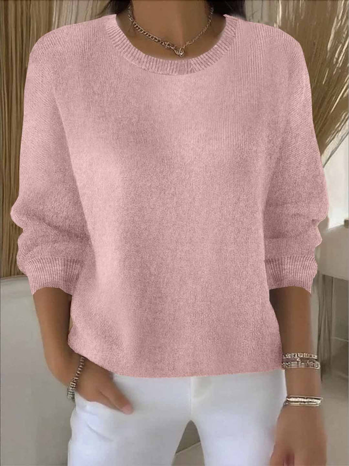 Model wearing a stylish women's V-neck sweater in a warm autumn color, perfect for fall.