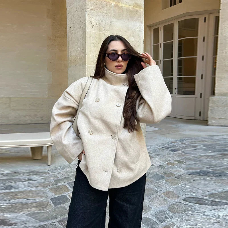 Elegant women's pea coat with a minimalist stand collar, ideal for everyday wear.