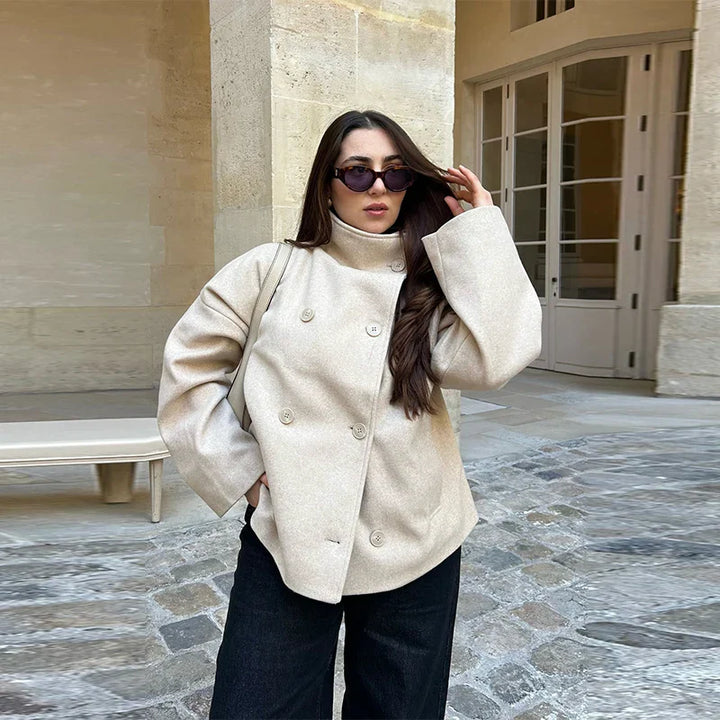 Elegant women's pea coat with a minimalist stand collar, ideal for everyday wear.