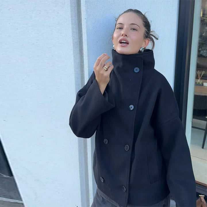 Sophisticated outerwear: women's elegant pea coat with a defined stand collar.