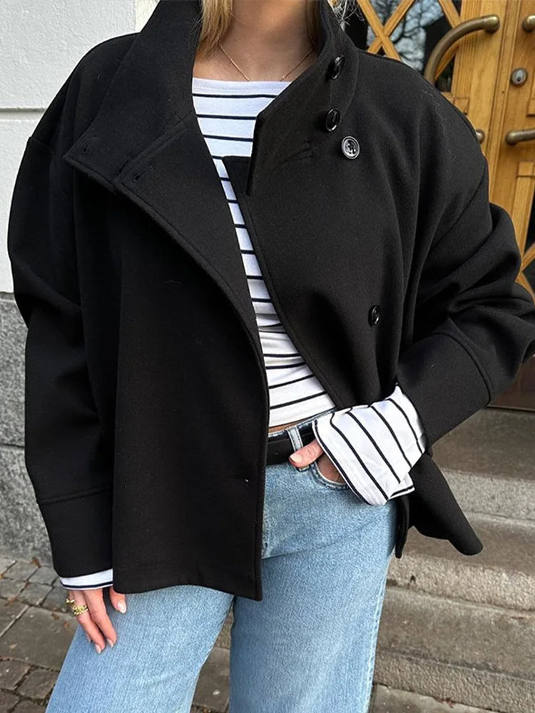 Versatile women's outerwear: a stylish pea coat with a modern stand collar.