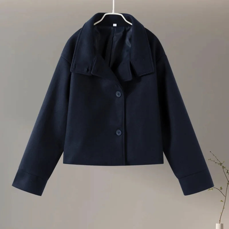 Fashionable outerwear: women's pea coat emphasizing the sleek stand collar.