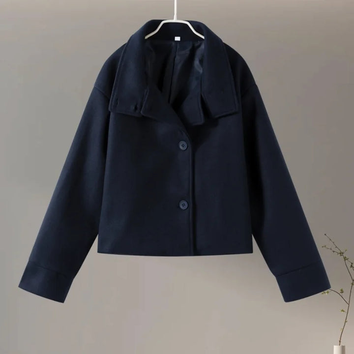 Fashionable outerwear: women's pea coat emphasizing the sleek stand collar.