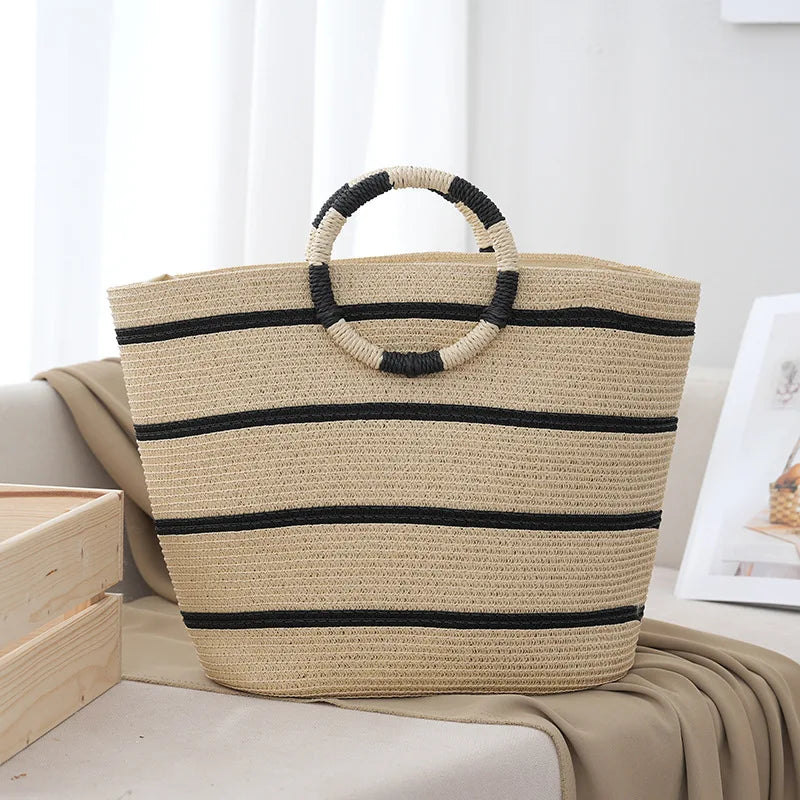 Women's striped beach tote bag with natural woven handles, perfect for summer outings and everyday use.