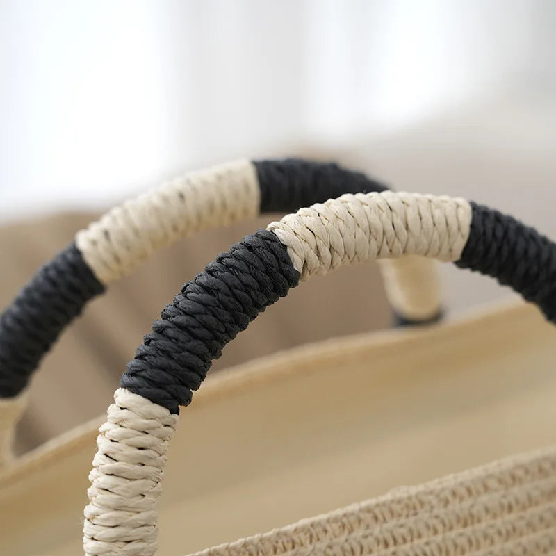 Stylish women's striped tote bag, a versatile summer handbag with comfortable woven handles for beach or casual use.